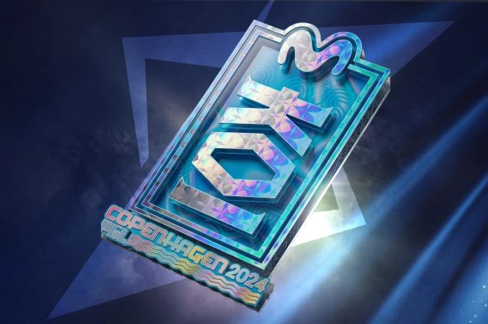 KOI Holo Sticker from the Copenhagen 2024 Major Contenders Sticker Capsule in CS2, released on March 13, 2024. This Exotic rarity sticker features a blue lucky charm-inspired design representing the Spanish esports organization KOI. Popular among players for blue-themed skin loadouts, the holographic sticker has a starting market price of $11.76, making it one of the more expensive team stickers from the Copenhagen 2024 Major collection.